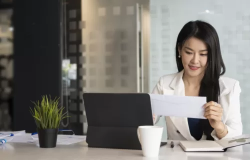 Businesswoman holding a letter
