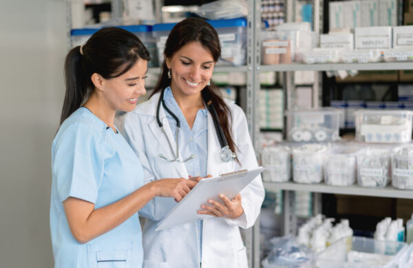 Doctor looking at clipboard