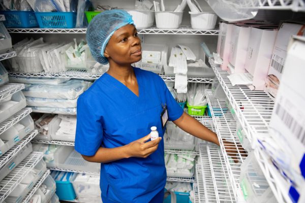 Nurse in medical supply closet