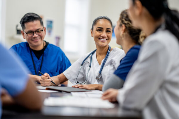 Nurses smiling in meeting